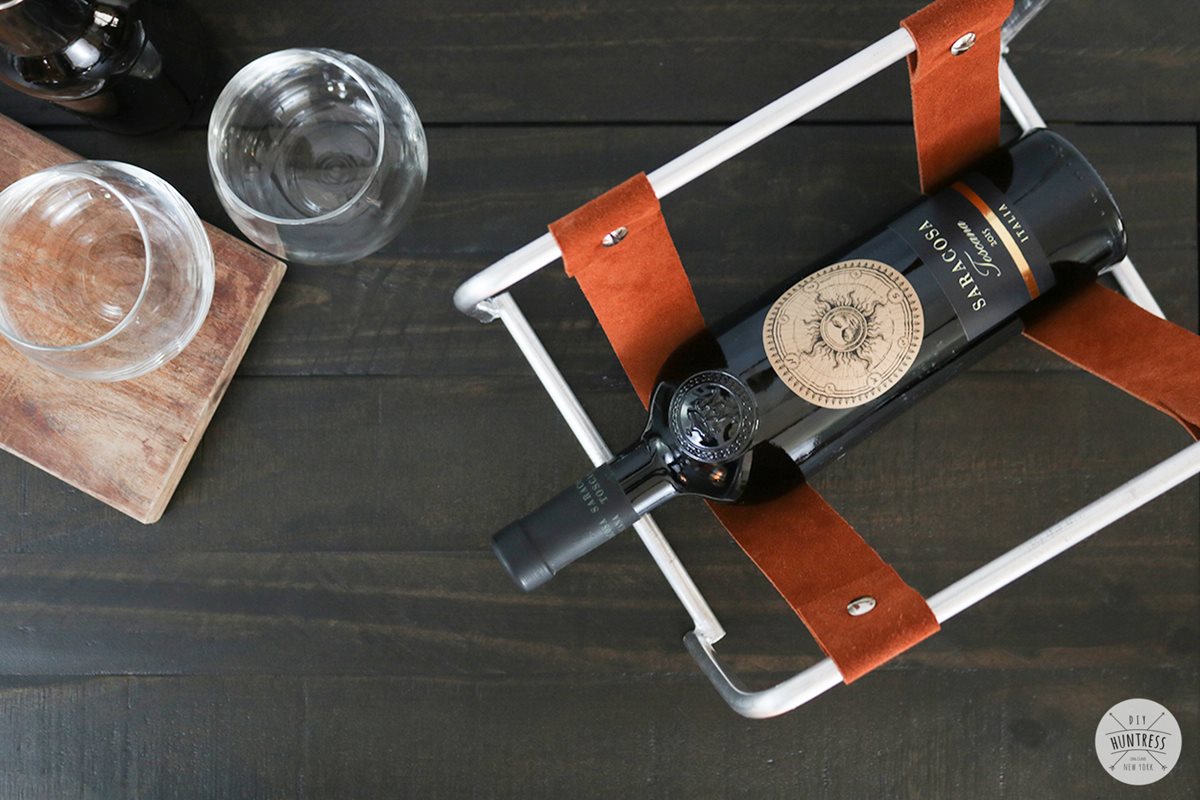 Wine rack with online leather straps