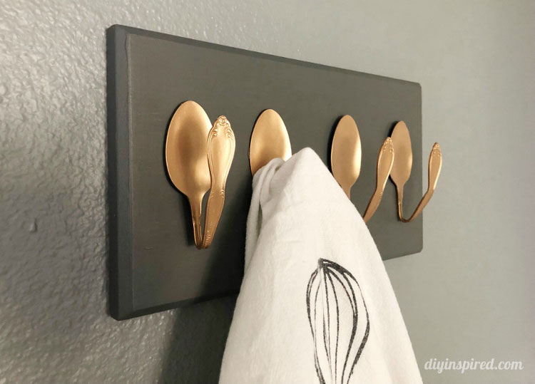 Towel hanging on spoon rack